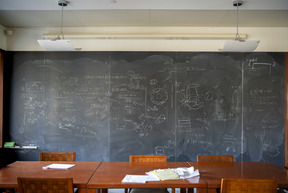 blackboard behind conference table