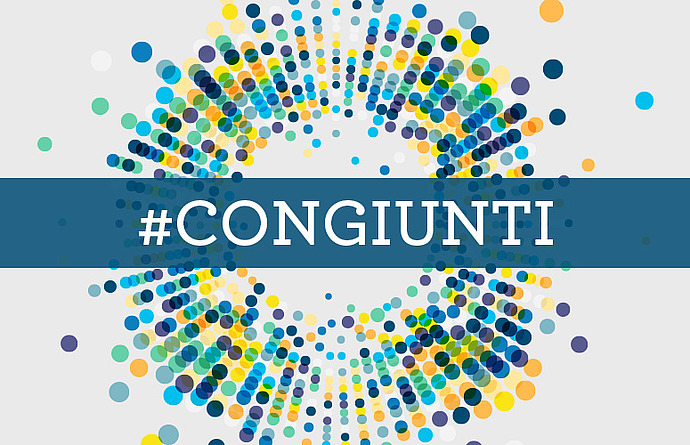 The text #congiunti on a stylized background